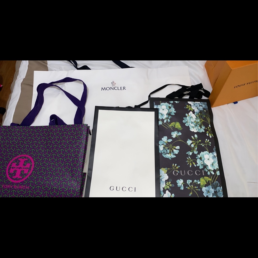 Gucci, moncler and Tory Burch shopping bags